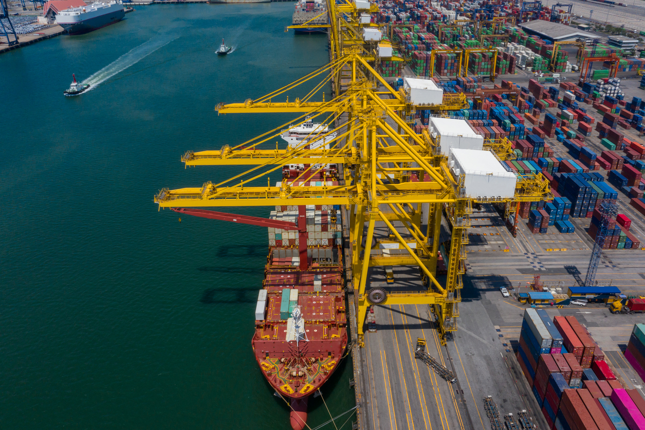 Container Ship In Export And Import Business And Logistics. Shipping Cargo To Harbor By Crane. Water Transport International. Aerial View And Top View.