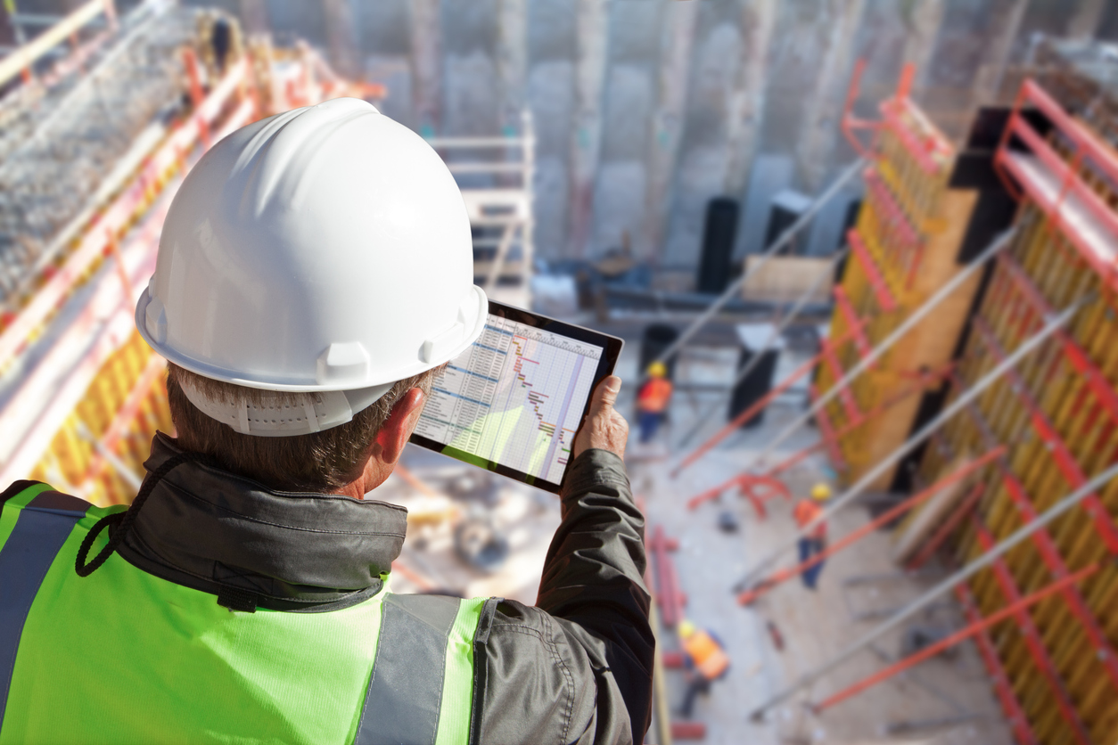 Engineer Architect Construction Worker On Construction Site With Tablet Computer