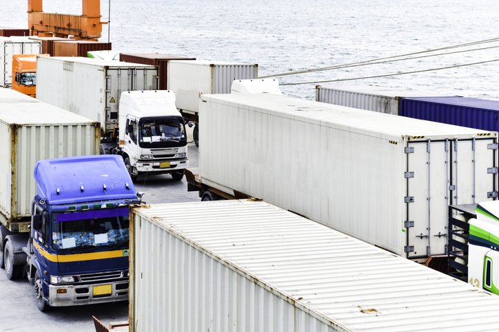 Container Truck Waiting To Load The Container Onto A Ship At A Seaport.