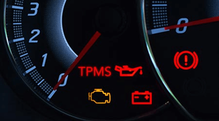 A picture of a car dashboard showing the TPMS icon