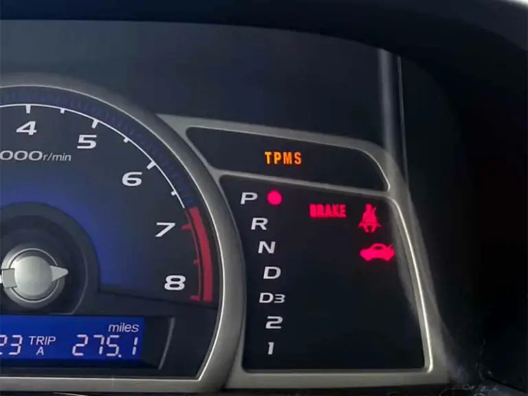  Picture of a car dashboard showing the TPMS icon