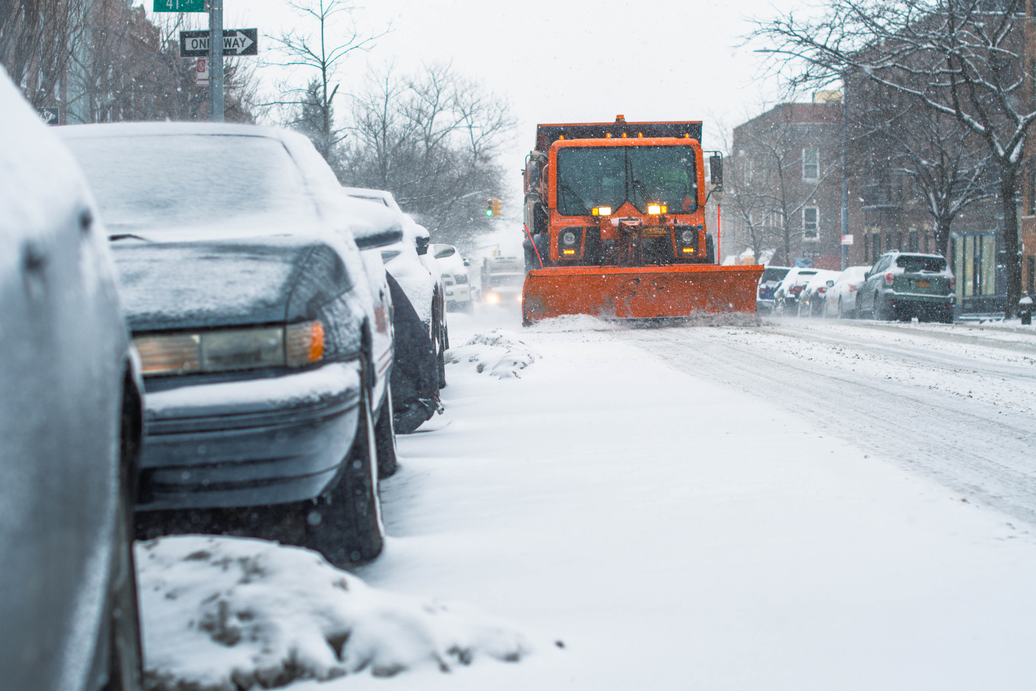 City During Snow Storm, Truck Moving Snow.